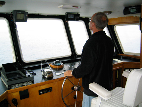 Capt. Ray at the helm of the SUNDIVER